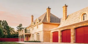 Exterior of The Charles Chateau, a French Chateau-inspired private estate in Dedham, Massachusetts at golden hour