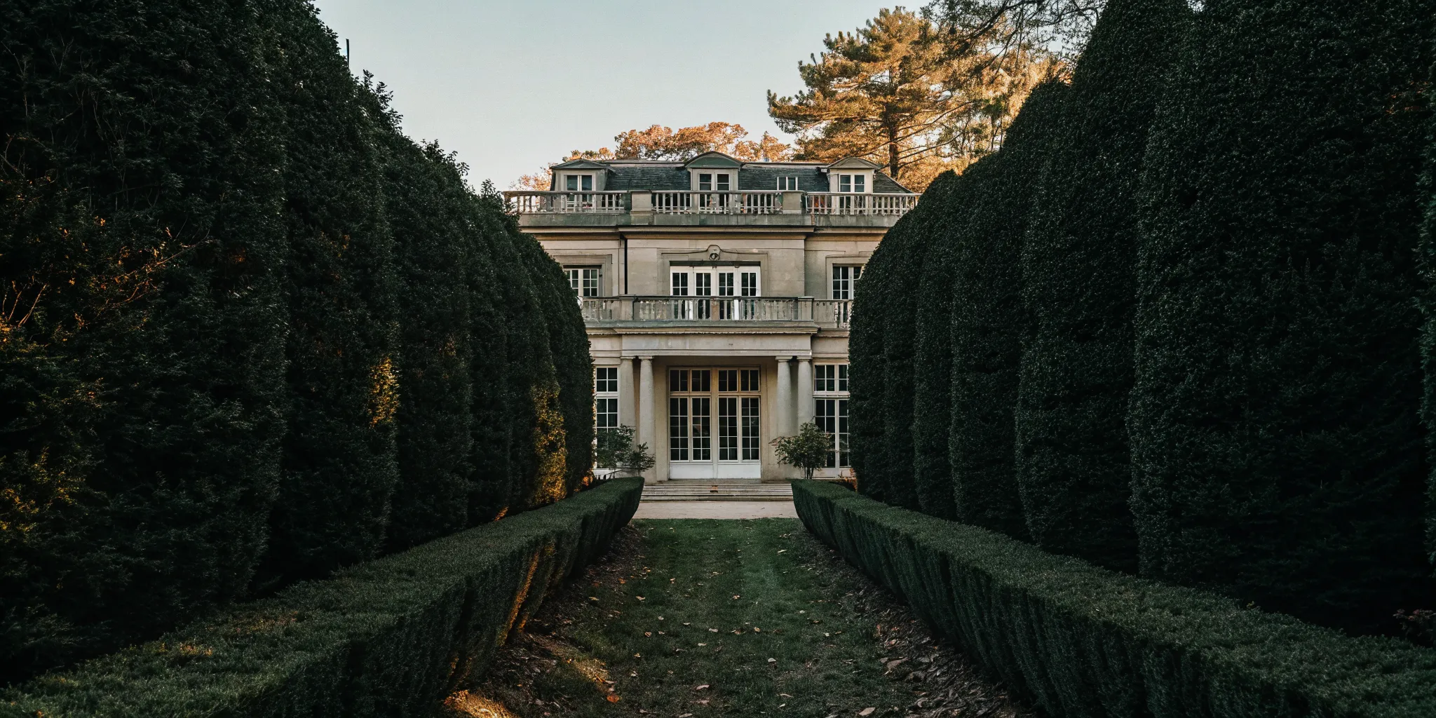 French Chateau-inspired stone mansion with manicured gardens on private estate grounds near Boston