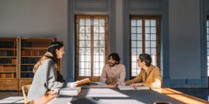Leadership team gathered in a sophisticated estate library for strategic planning discussions