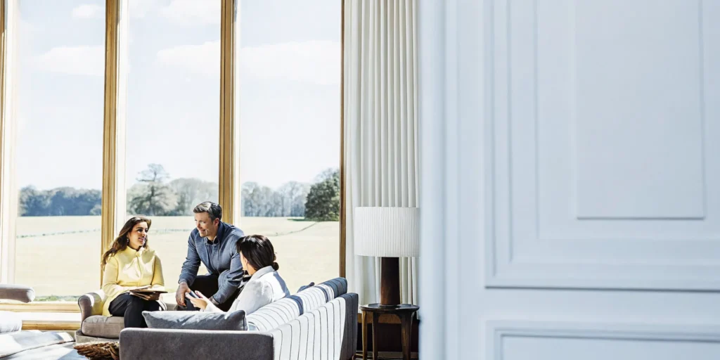 Leadership team in conversation in the elegant lounge of a private chateau estate near Boston