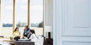 Leadership team in conversation in the elegant lounge of a private chateau estate near Boston