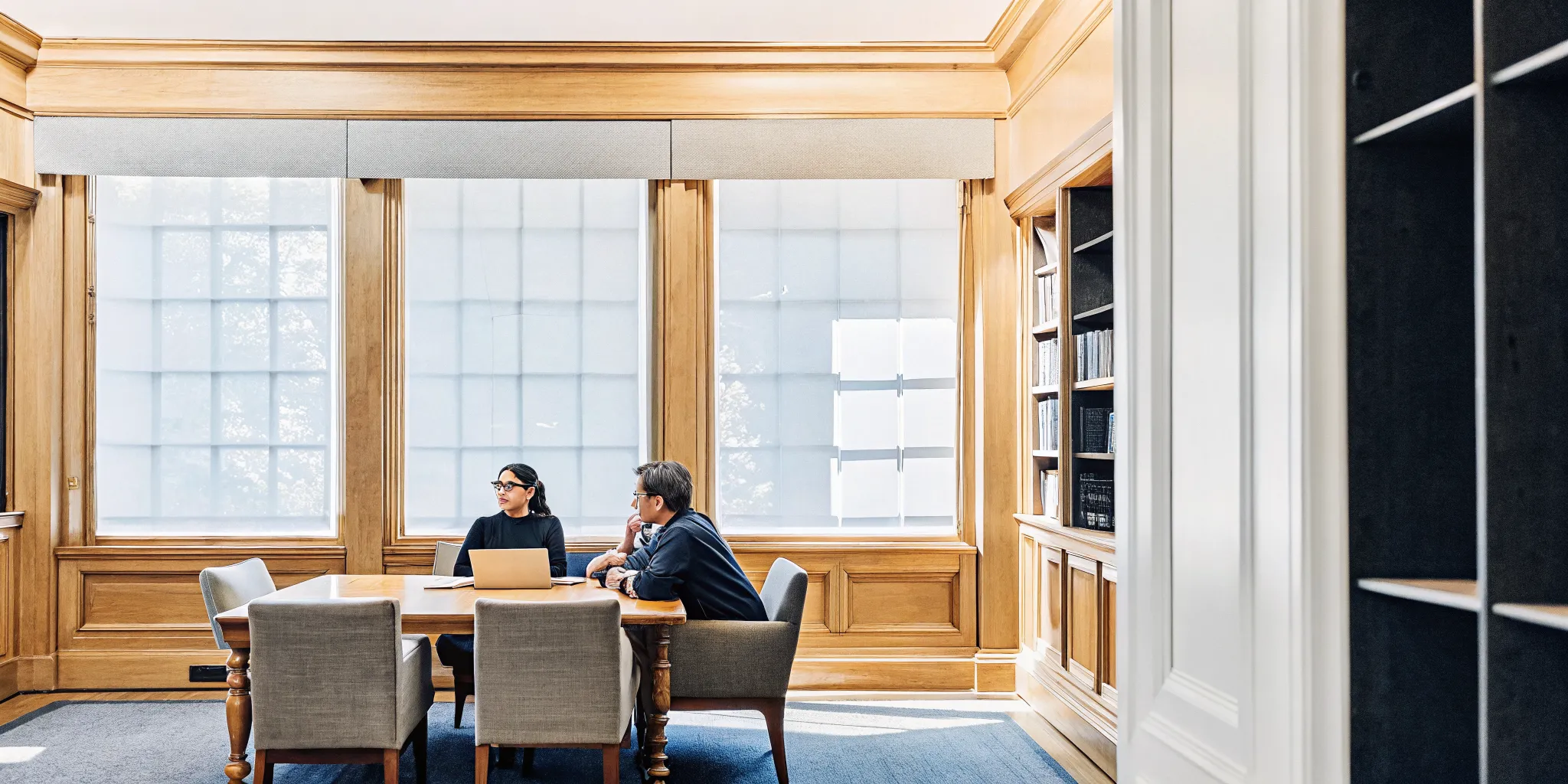 Executive team meeting in a private estate library near Boston